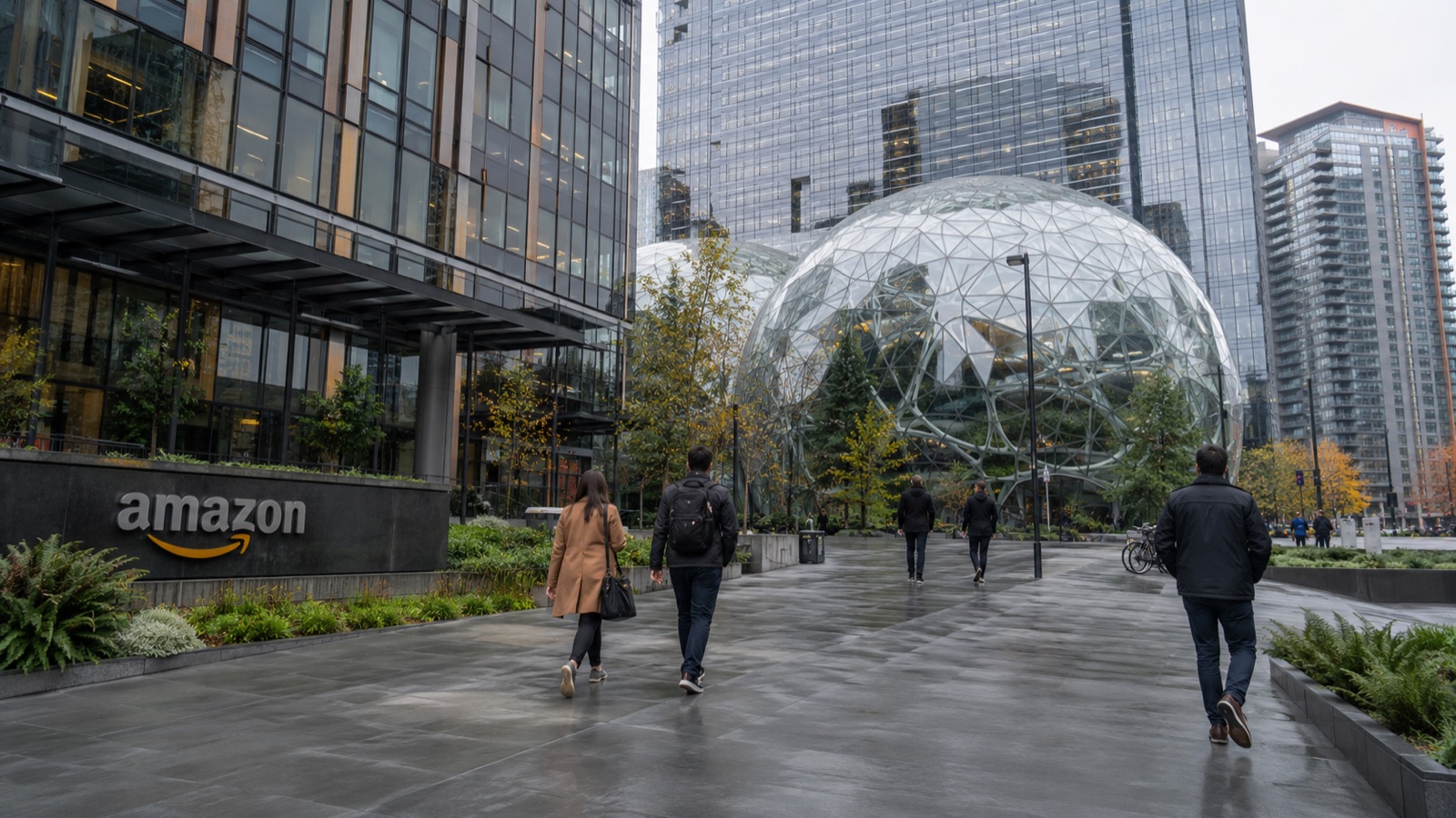 Amazon's Seattle headquarters, with the Spheres and the amazon logo, as people walk past